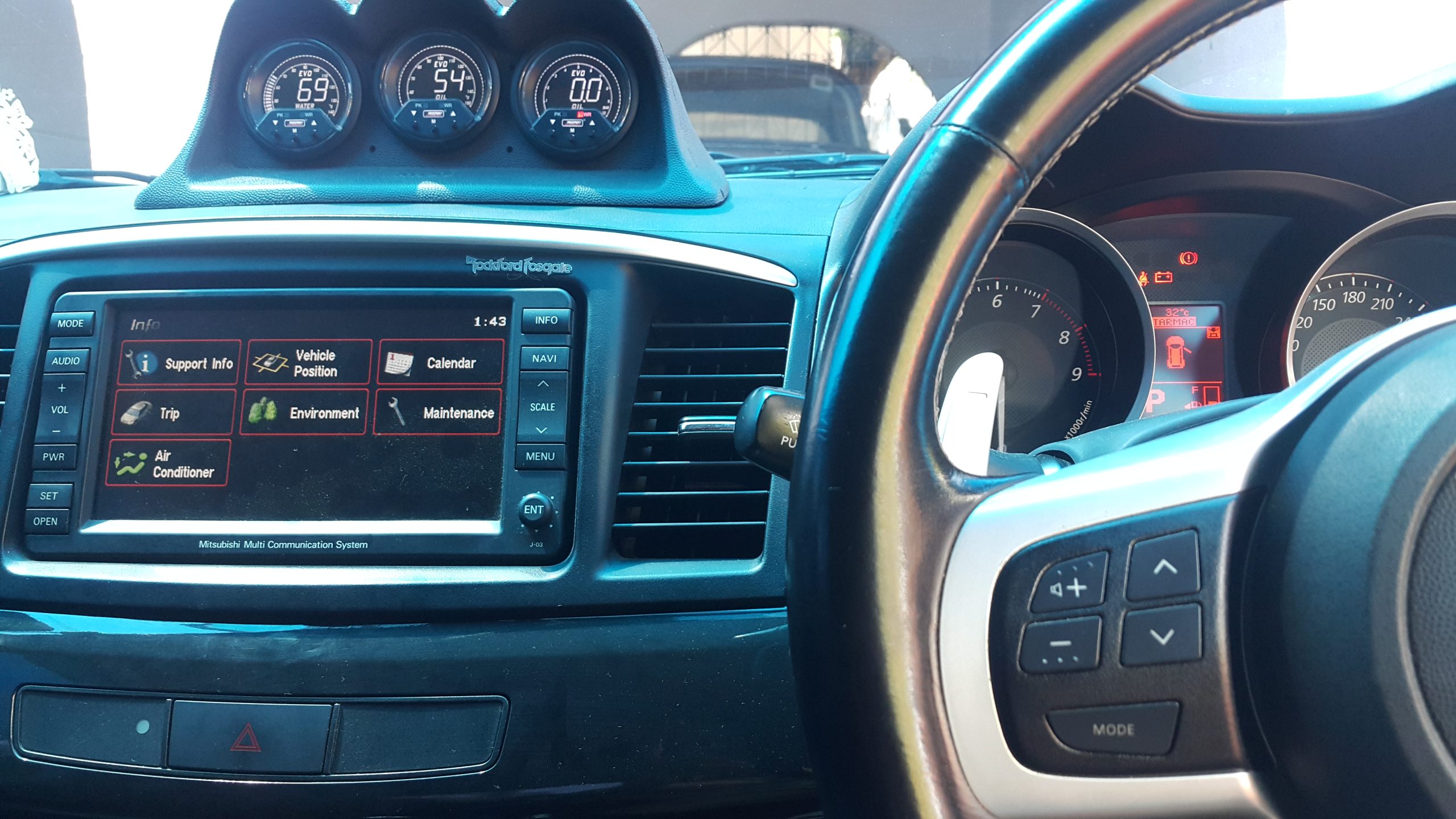 Mitsubishi MMCS fitted in a vehicle, displaying its information menu in English